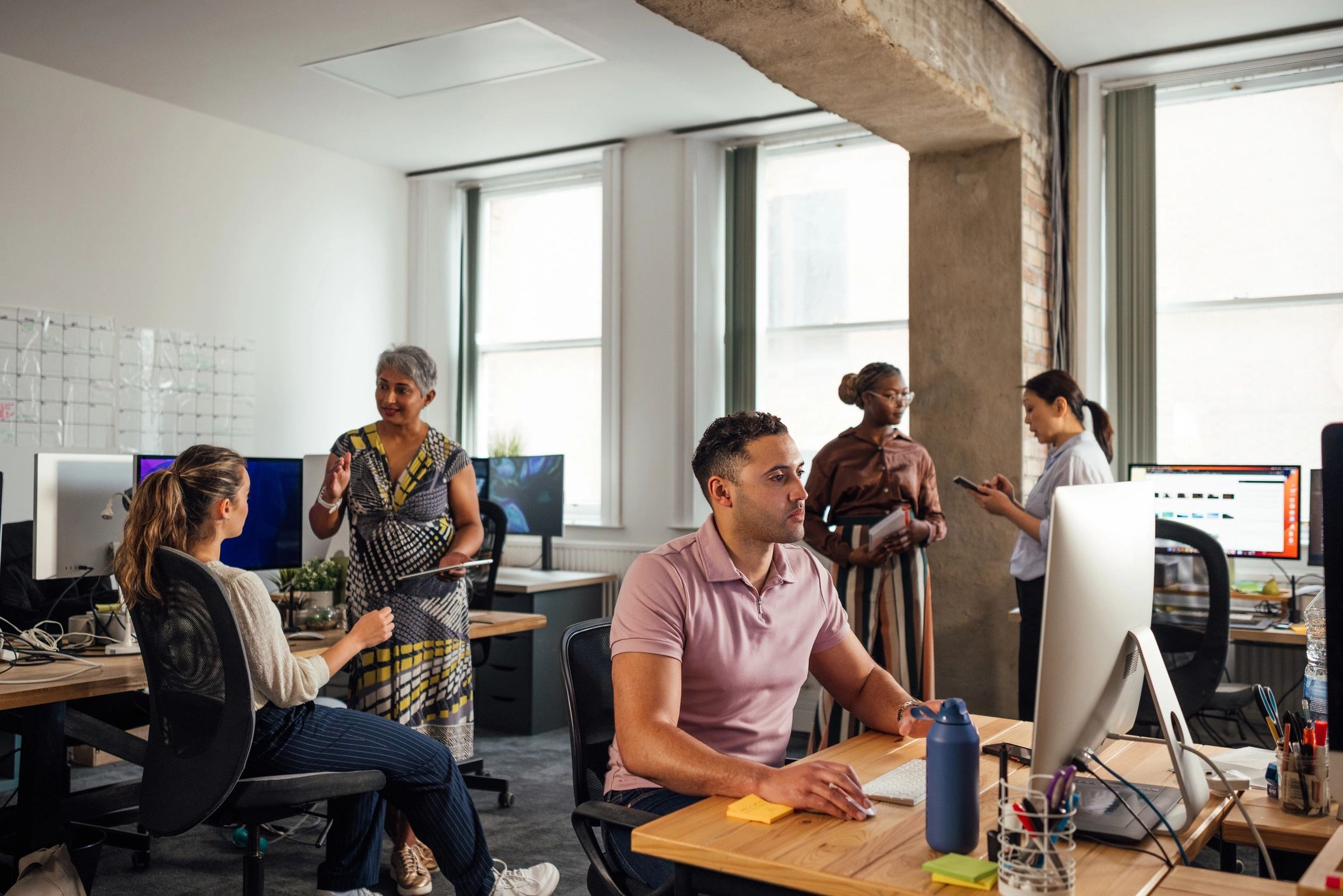 Team collaborating in a modern studio office