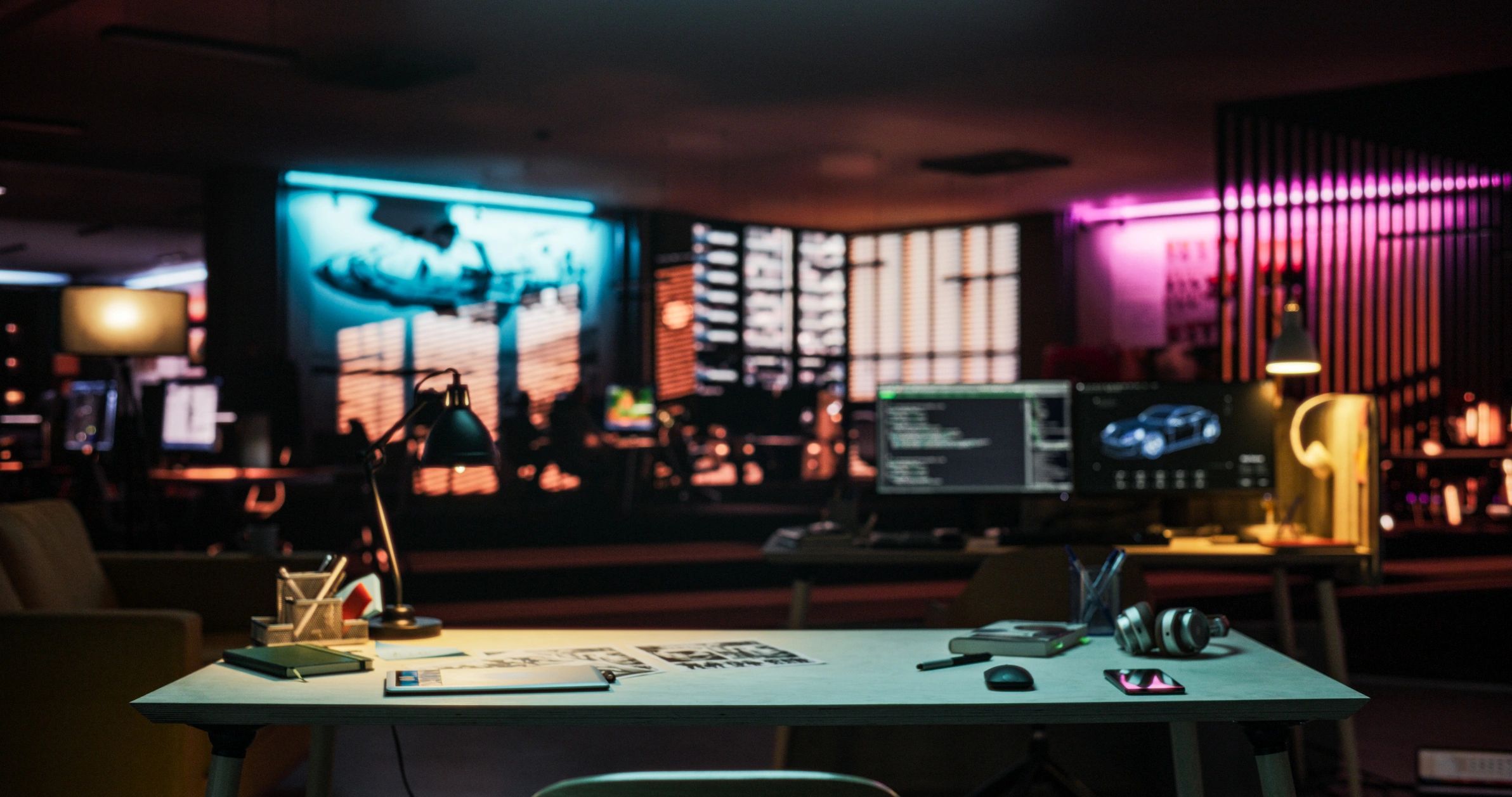 Neon-lit game development workspace